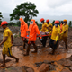 Emergency personnel carry the body of a victim at the site of a landslide at Taliye, a village in India about 110 miles (180 kilometers) southeast of Mumbai, on July 24, 2021.